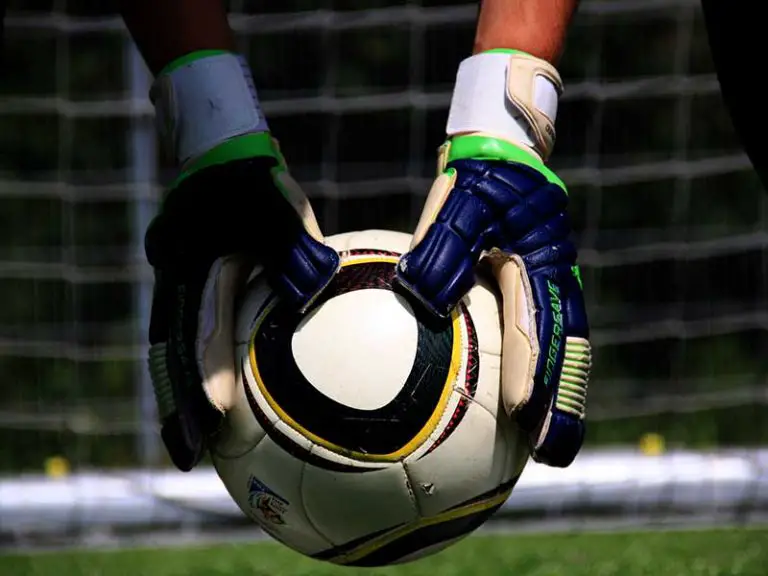 soccer goalie holding ball